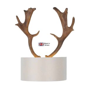 Artemis rustic antler wall washer light with bespoke fabric shade on white background lit