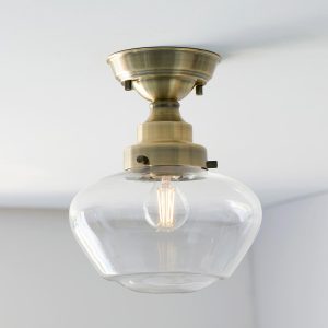 Timeless antique brass 1 light semi flush low ceiling light with clear glass shade main image
