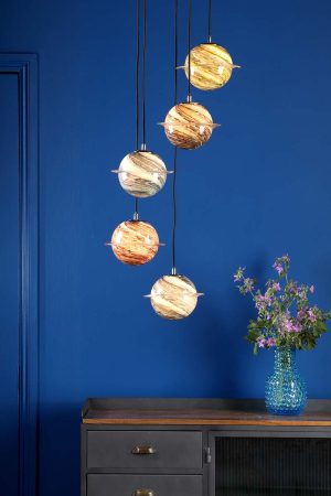 Cygnus 5 light cluster pendant in polished chrome with planet glass globes in room setting lit