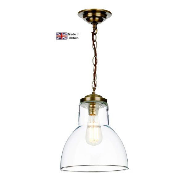 Upton small solid brass 1 light pendant with clear glass shade on white background lit