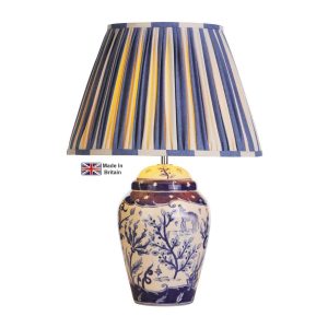 Devana blue and white ceramic table lamp base only shown on white background with shade lit