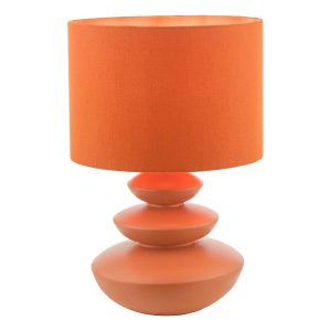 Discus ceramic table lamp in flat orange with cotton mix shade, on white background lit