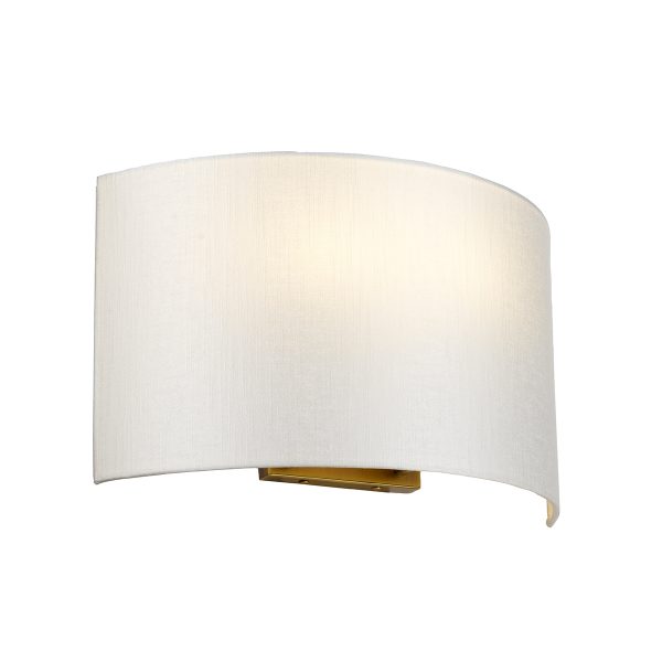 Cooper 2 light large curved wall light with ivory shade and aged brass wall plate on white background, lit.