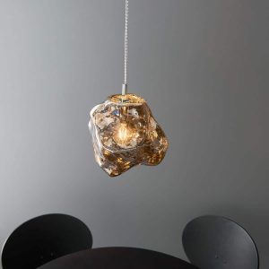Rock 1 light ceiling pendant with chrome volcanic glass low over table