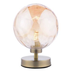 Esben touch table lamp in antique brass with dimpled champagne glass on white background