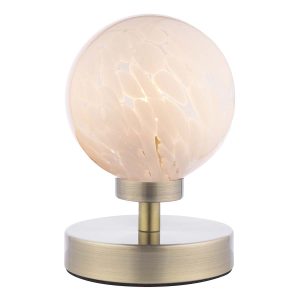 Esben touch table lamp in antique brass with white confetti glass globe on white background lit