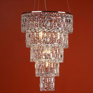 Escala 6 light crystal chandelier in polished chrome on terracotta background