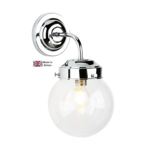 Fairfax single wall light in chrome plated solid brass with clear glass shade on white background lit