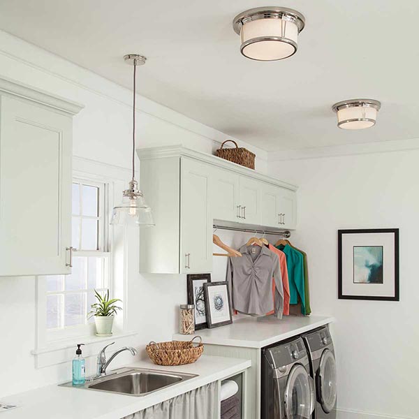 Flush ceiling lights in a small kitchen, together with a pendant over the sink area.