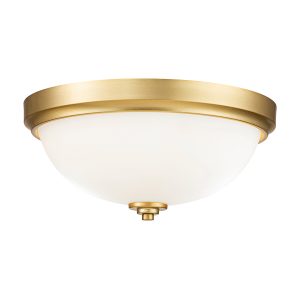 Feiss Malibu flush bathroom ceiling light in brushed brass on white background lit.