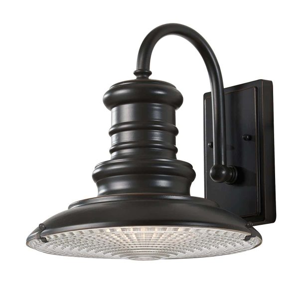 Feiss Redding Station medium outdoor wall lantern in restoration bronze with prismatic glass on white background.