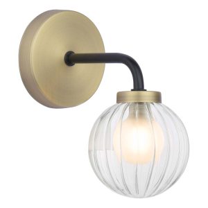Gibbs classic single wall light in antique brass with glass shade on white background lit