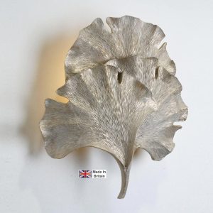 Gingko leaf single wall washer light in cream and gold on white background lit