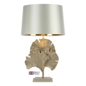 Gingko leaf table lamp in cream and gold on white background lit