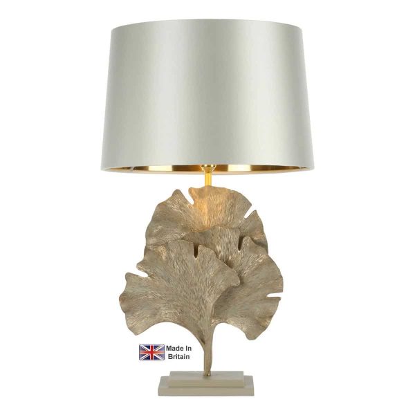 Gingko leaf table lamp in cream and gold on white background lit