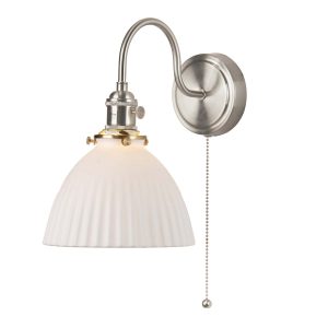 Hadano switched wall light in antique chrome with domed white ceramic shade on white background lit