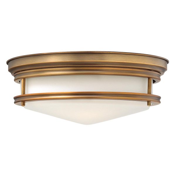 Hinkley Hadley Art Deco design brushed bronze 3 lamp flush light on white background.