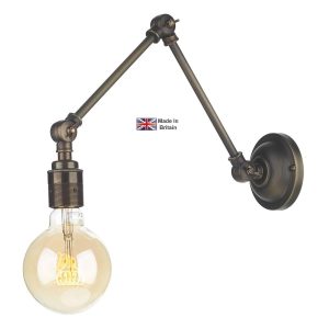 Hoxton swing arm wall light in solid antique brass on white background lit