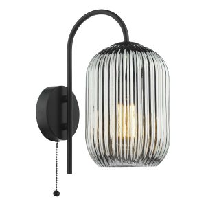 Idra single switched wall light with ribbed smoked glass shade in matt black, on white background lit