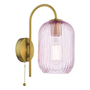 Idra single switched wall light with pink ribbed glass shade in aged bronze, on white background lit