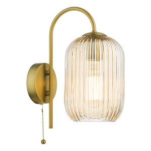 Idra single switched wall light with ribbed champagne glass shade in aged bronze, on white background lit