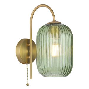 Idra single switched wall light with green ribbed glass shade in aged bronze, on white background lit