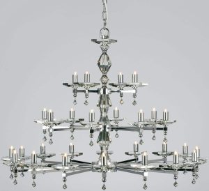 Impex Capri large optic glass 28 light chandelier finished in polished nickel, shown on a grey background.