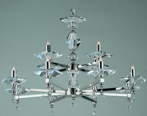 Impex Capri optic glass 12 light chandelier finished in polished nickel, shown on grey background.