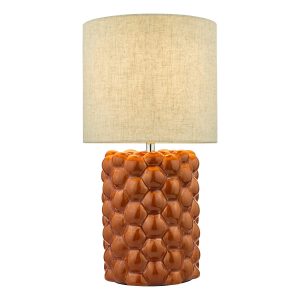 Jayden ceramic table lamp with orange glaze and natural linen shade lit on white background