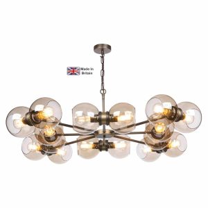 Juno large 18 light ceiling pendant in solid brass on white background lit