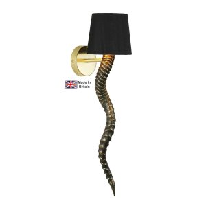 Kudu handmade single wall light in black and gold on white background lit