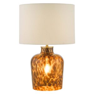 Leandra dual light tortoiseshell glass table lamp with white linen shade, on white background lit