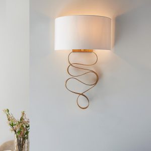 Contemporary 1 light gold leaf ribbon wall light with ivory cotton shade insitu