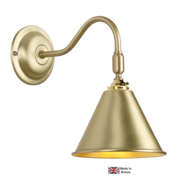 London classic adjustable wall light in solid butter brass on white background lit