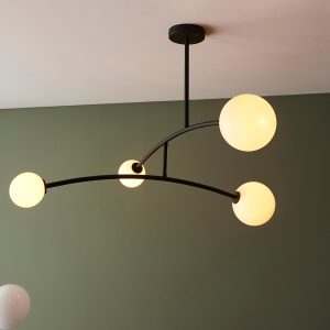 Modern 4 light pendant in matt black with opal glass globe shades main image