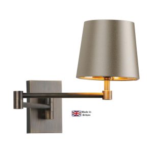 Muswell 1 light swing arm wall light in solid antique brass on white background lit