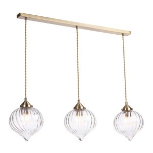 Mya 3 light bar pendant with ribbed clear glass shades in antique brass, on white background lit
