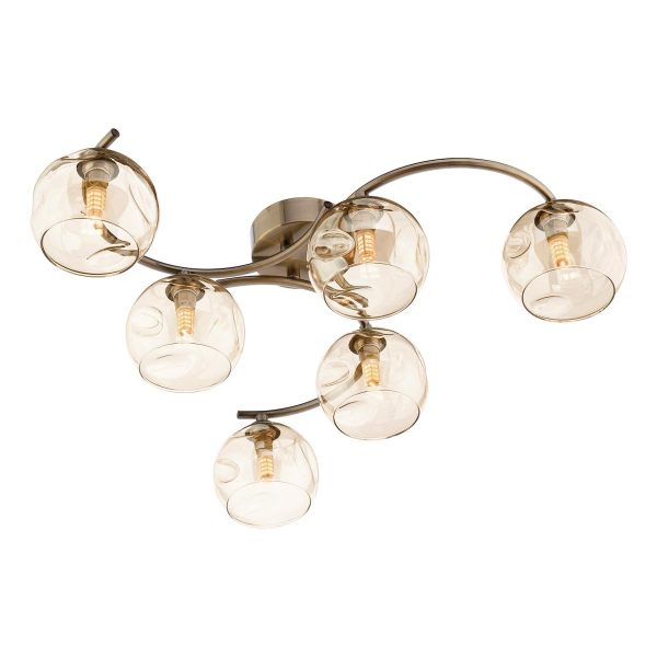 Nakita 6 light flush ceiling light with dimpled champagne glass shades in antique brass on white background lit