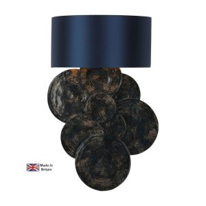Planet single wall light in inky blue and gold with Poseidon shade on white background lit