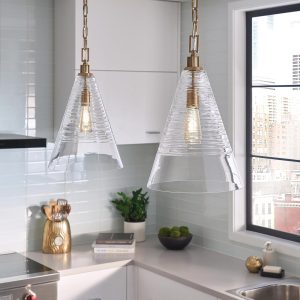 Quintiesse Elmore candy glass pendant light in burnished brass hanging in kitchen