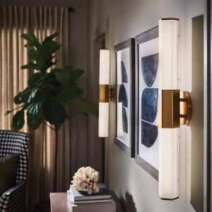 Quintiesse Facet 2 light LED bathroom wall light in heritage brass either side of mirror