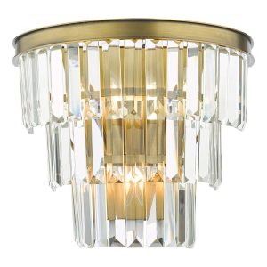Rhapsody 3 lamp tiered crystal wall light in solid natural brass on white background lit