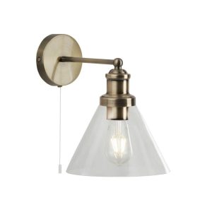 Pyramid 1 light switched wall light in antique brass finish with clear glass shade