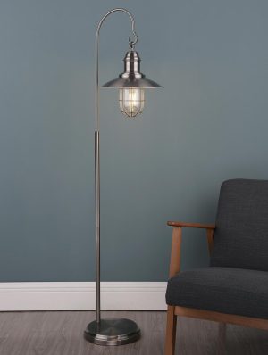 Terrace 1 light floor lamp in antique chrome next to sitting room chair