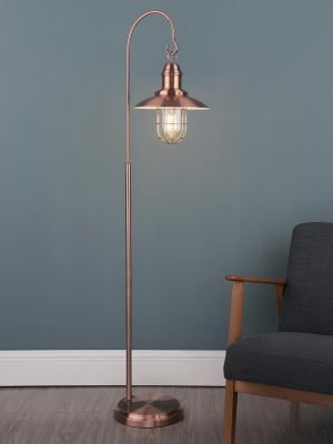 Terrace 1 light floor lamp in antique copper, next to sitting room chair